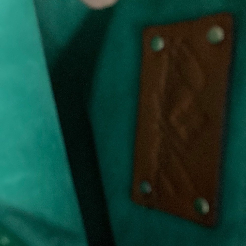 leather tote easily converts into computer bag
